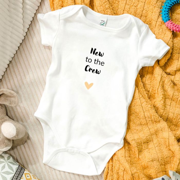 Gepersonaliseerde baby romper met spreuk en hartje